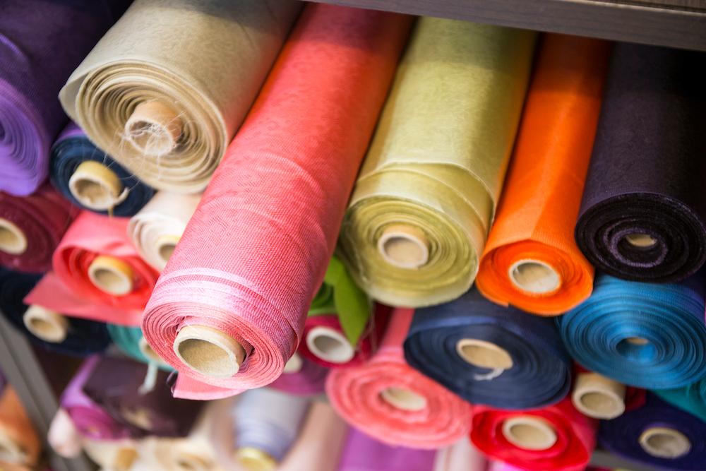 Colorful fabric spools.