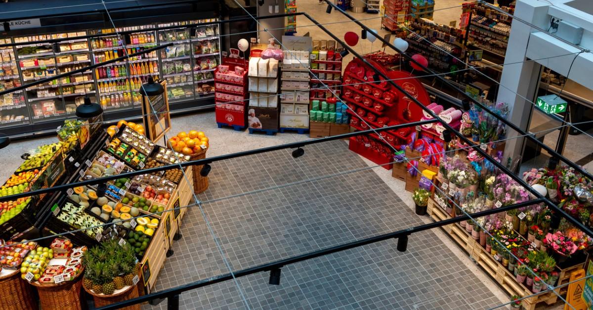 Overhead look at the freezer section and produce section in a grocery store