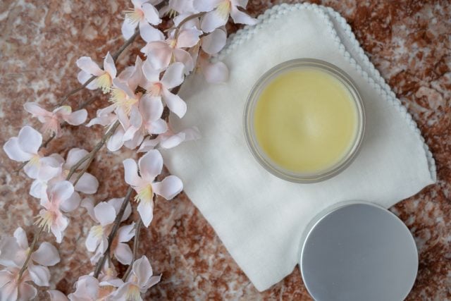 Cleansing Balm on counter with flowers