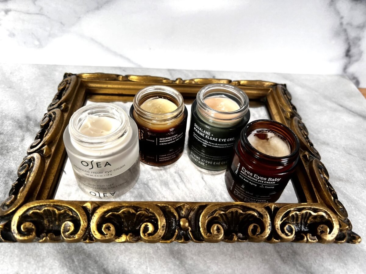 eye creams on gold mirror tray