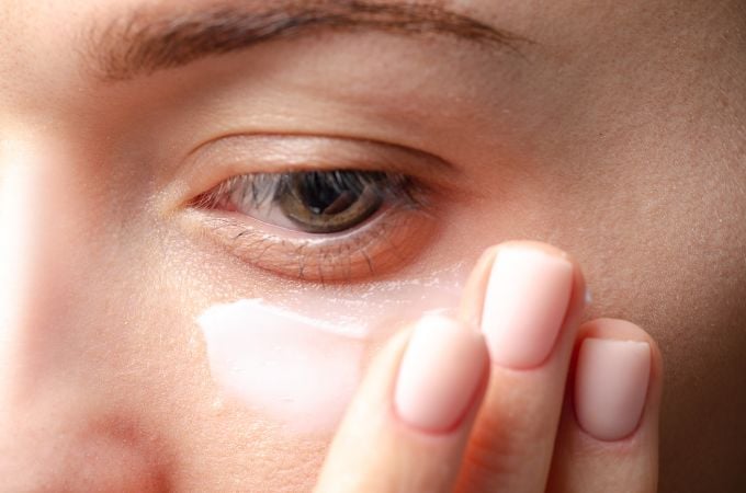 woman applying eye cream